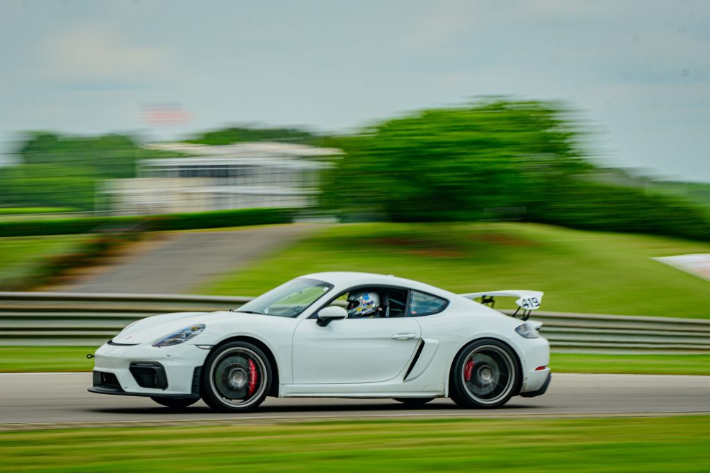 Porsche GT 4 driving fast on race track